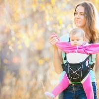 This is a happy mom who has no clue that she may be causing hip dysplasia in her daughter. This carrier puts a great deal of pressure on the baby's hip sockets and may lead to real trouble later in life.  It could also have an effect on her growth and development now.  Where do parents take their kids for chiropractic? Dr. Lou at Perinatal & Pediatric Chiropractic of Maine in Portland. (207) 553-7776