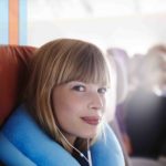 A neck pillow for sleeping on the plan may save your vacation!
